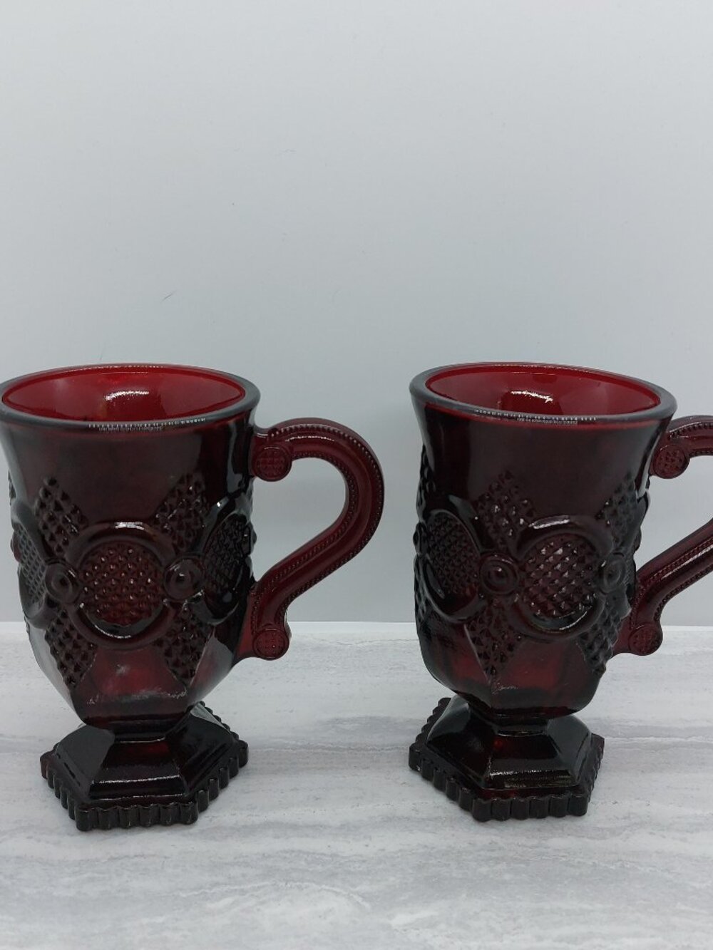 2 Vintage Avon Ruby Red Cape Cod 1876 Collection Glass Footed 5" Mugs